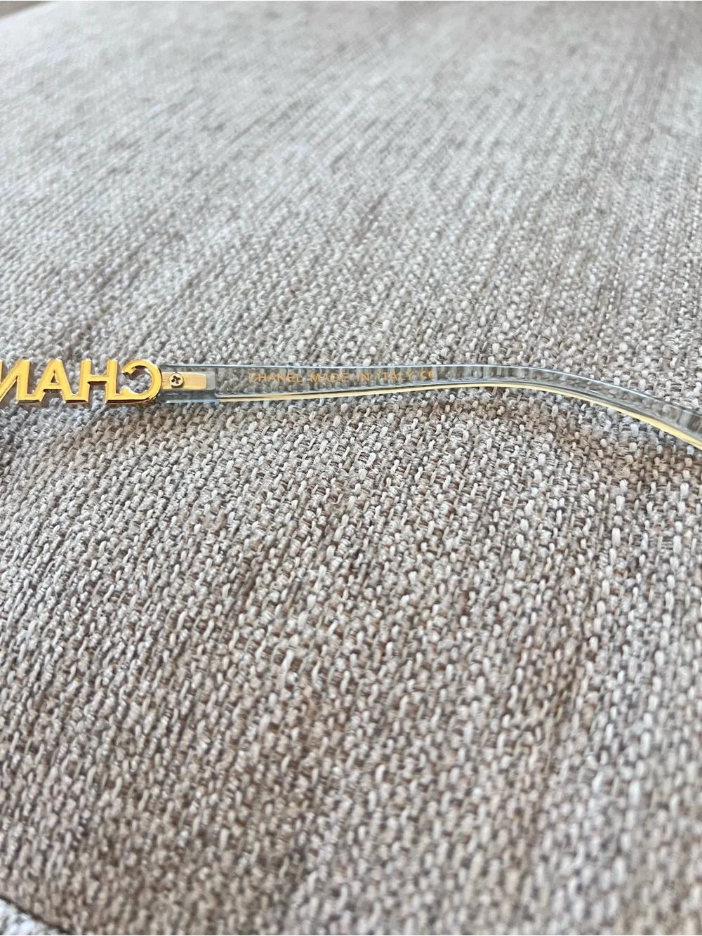 CHANEL Transparent Light Blue Frame Glasses with Gold Logos